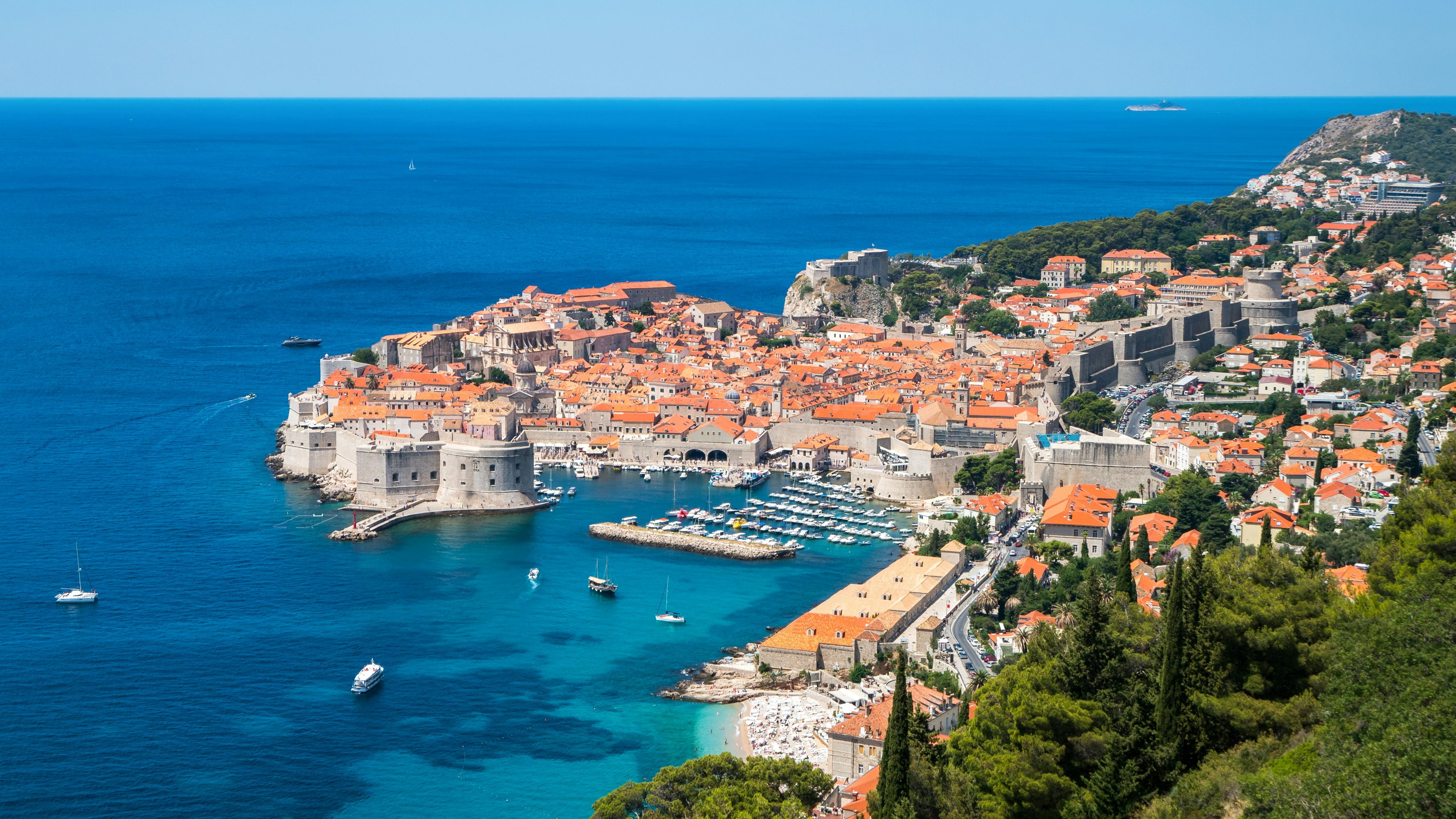 Aerial view of Dubrovnik old town, terracotta rooftops and Adriatic coastline, Croatia
